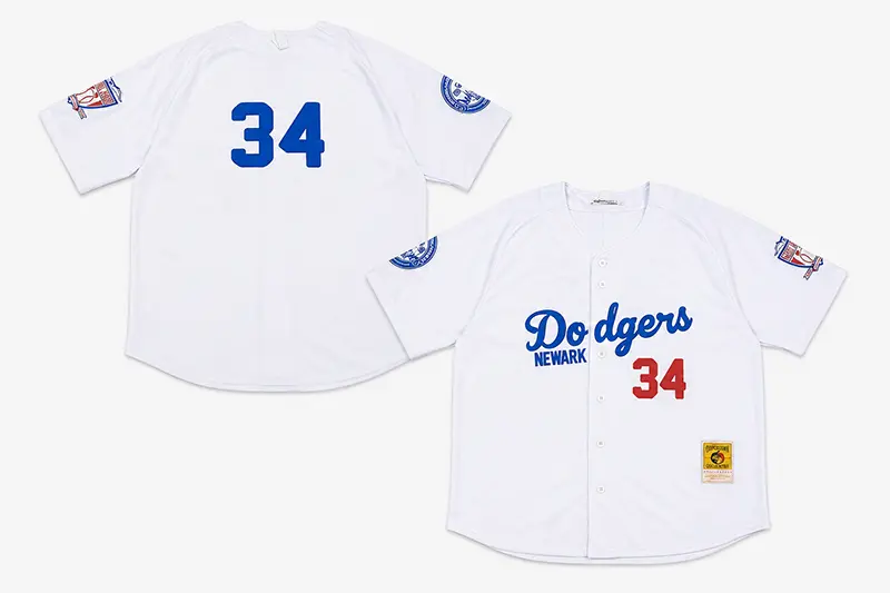 White button-front baseball jersey shown from the front and back with sleeve patches and number 34