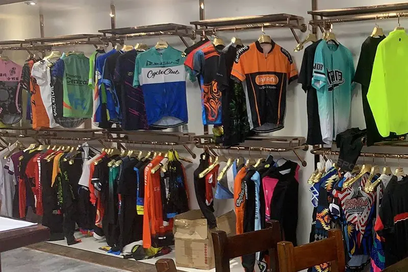 Cycling jersey samples displayed by color and design