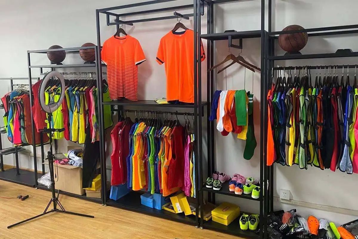 Colorful teamwear arranged on showroom racks