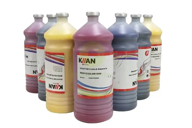 Bottles of magenta, blue, and yellow sublimation ink