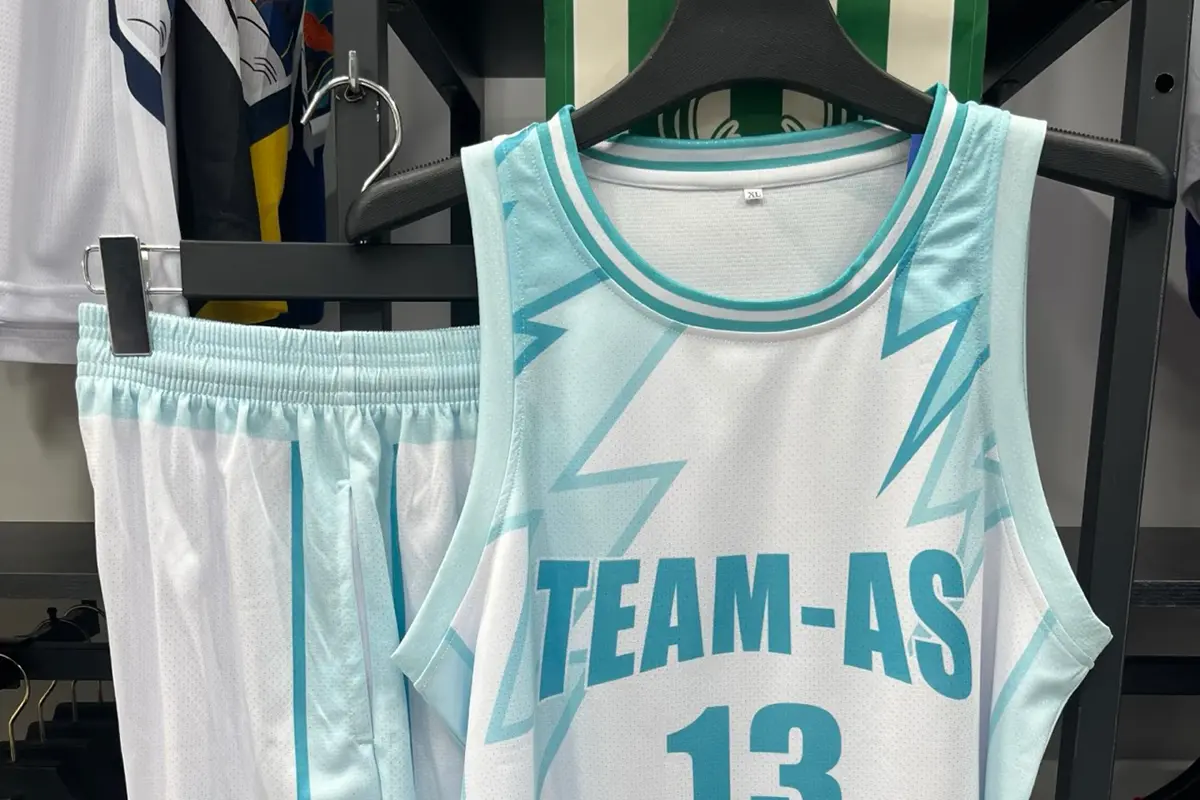Basketball jersey and shorts set displayed together on a hanger