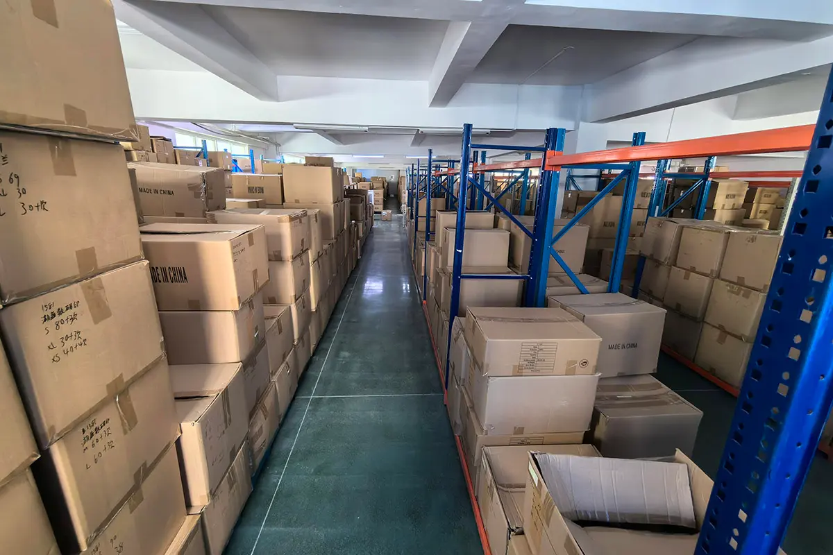 Packed export cartons stored between warehouse racks