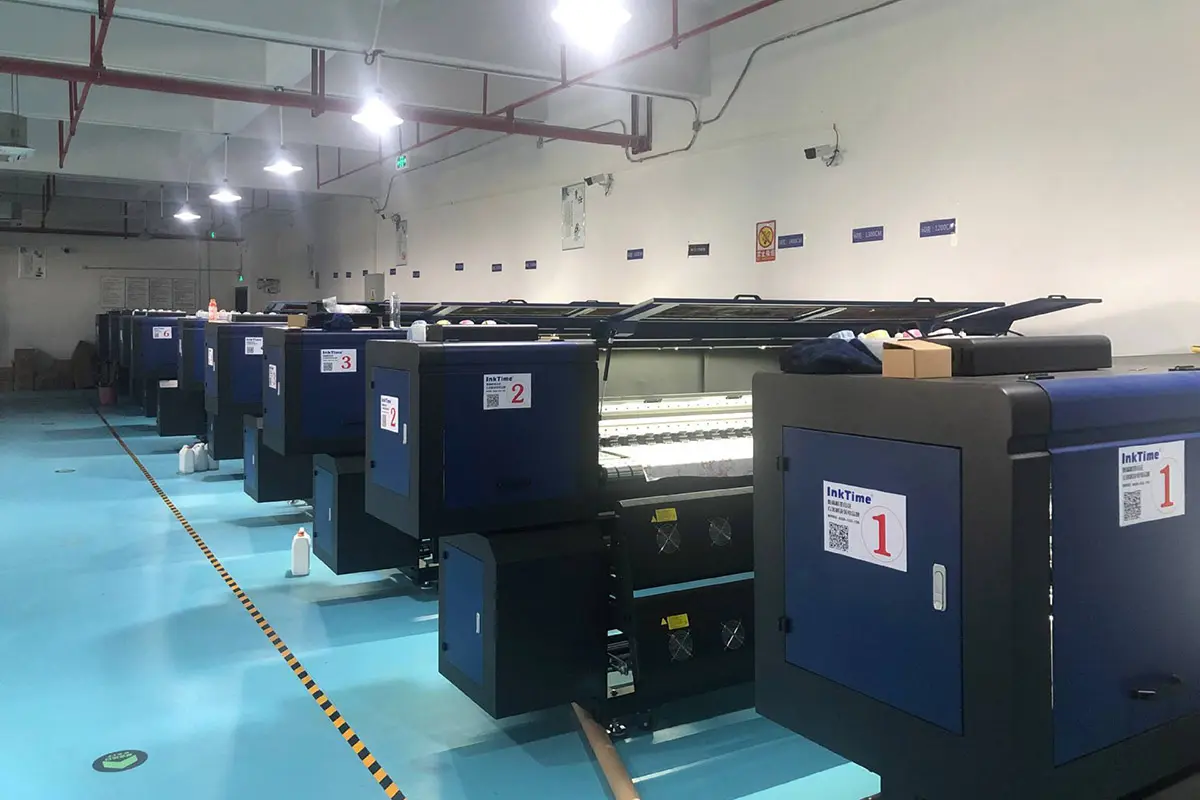 Rows of wide-format printers in the production room