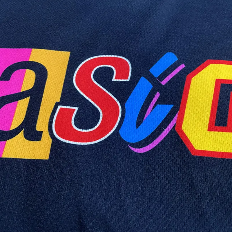 Close-up of multicolor chest artwork on a black hockey jersey