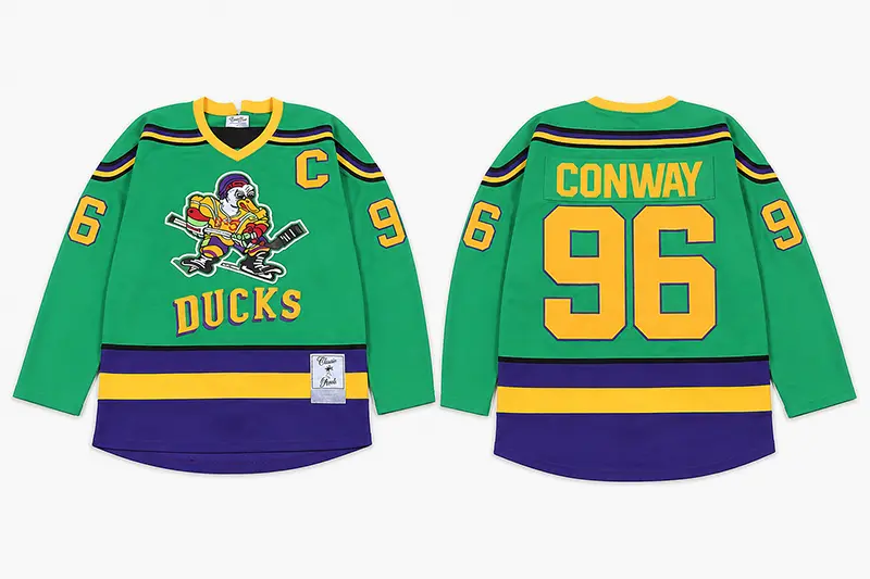 Green hockey jersey shown from the front and back with crest and player number