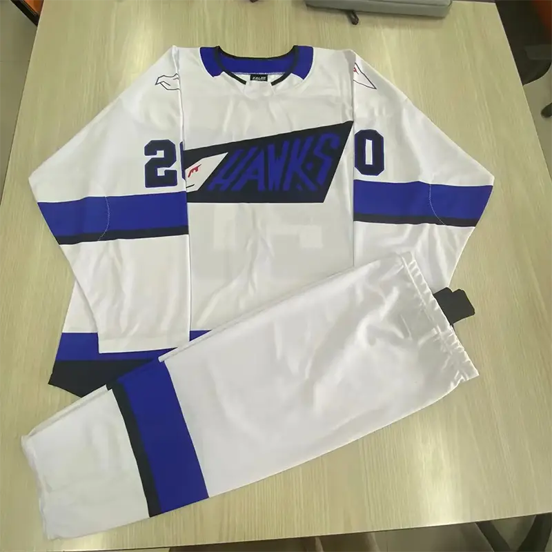 White and blue hockey jersey and pants set with number 20