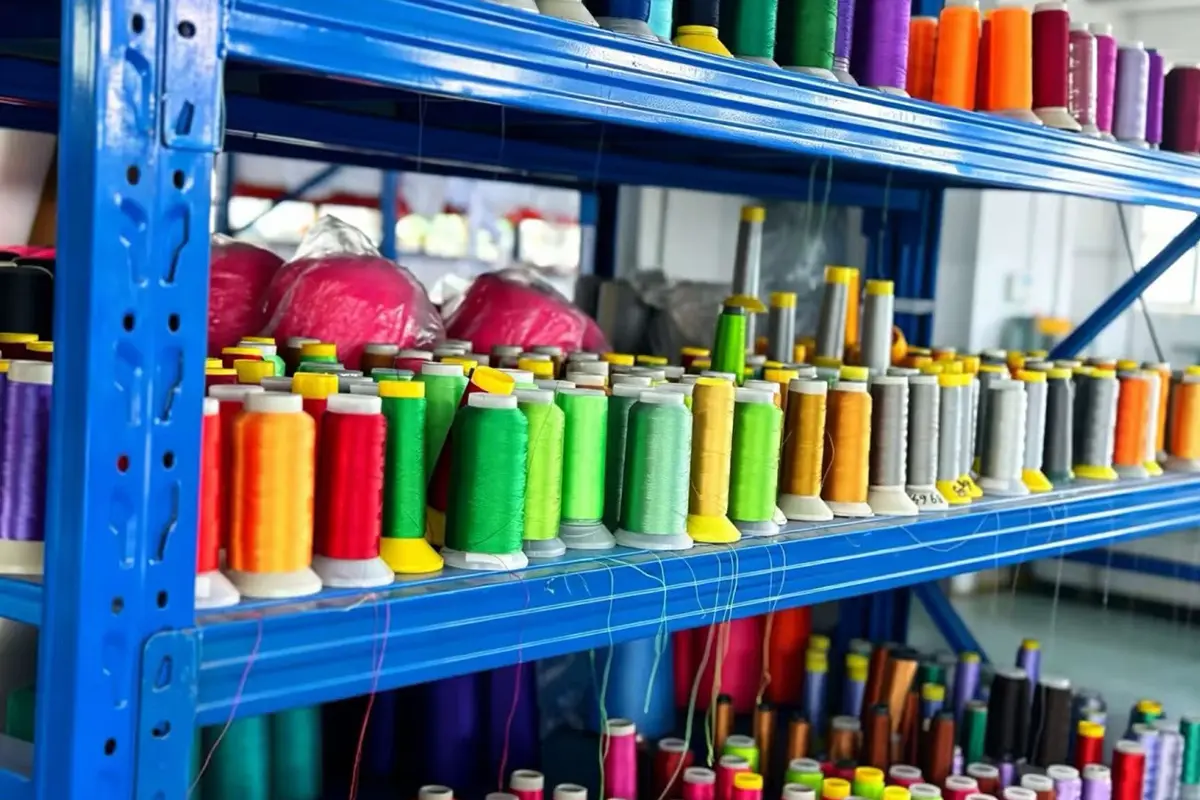 Colored embroidery threads organized for team crest and sponsor work
