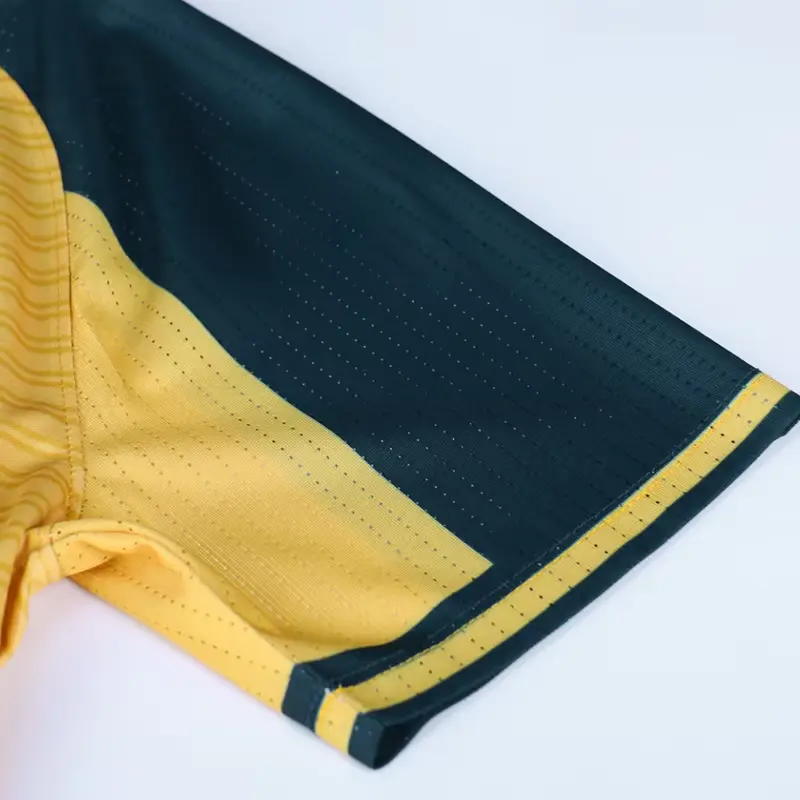 Close-up of a navy mesh panel and yellow trim on soccer shorts