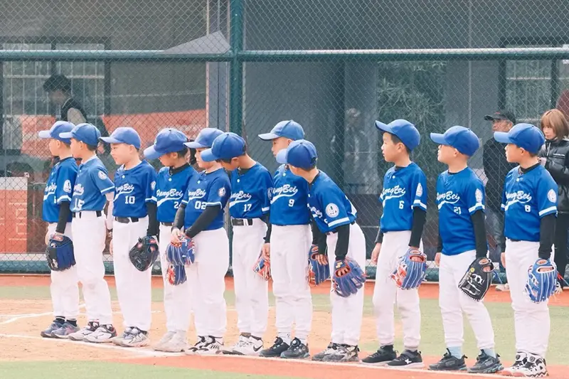 Youth team wearing matching button-front jerseys for fit reference