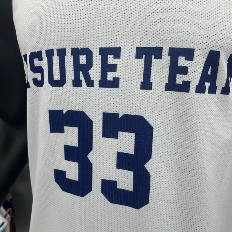 Navy team lettering and number 33 printed on white mesh basketball fabric