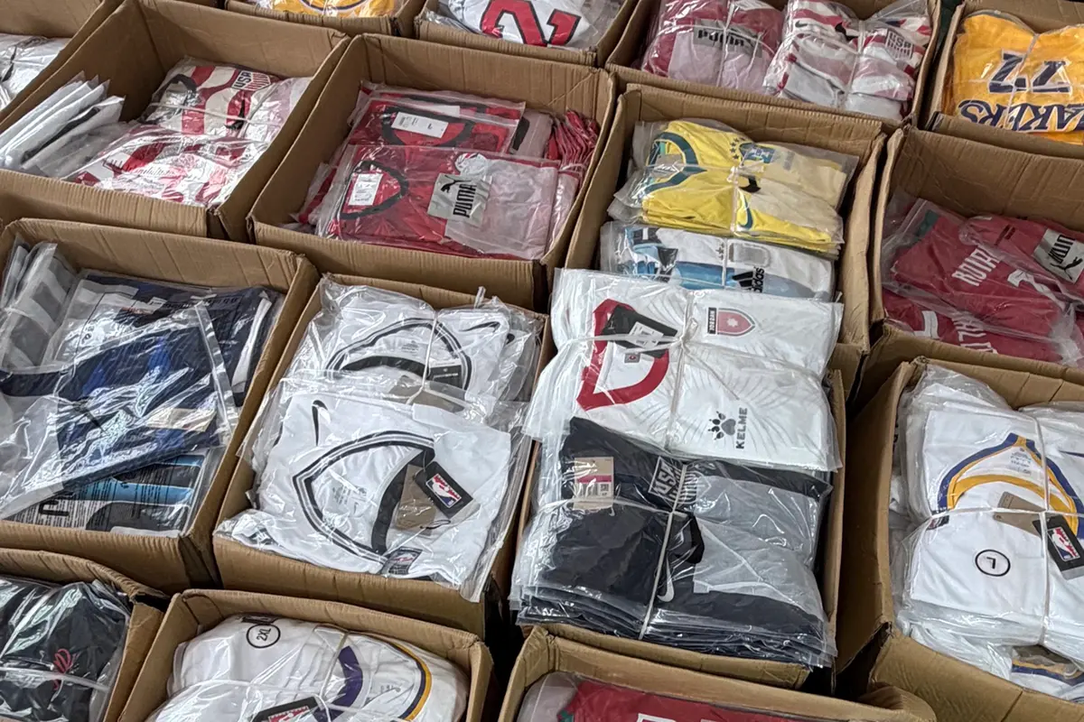 Individually packed team uniforms sorted into open cartons
