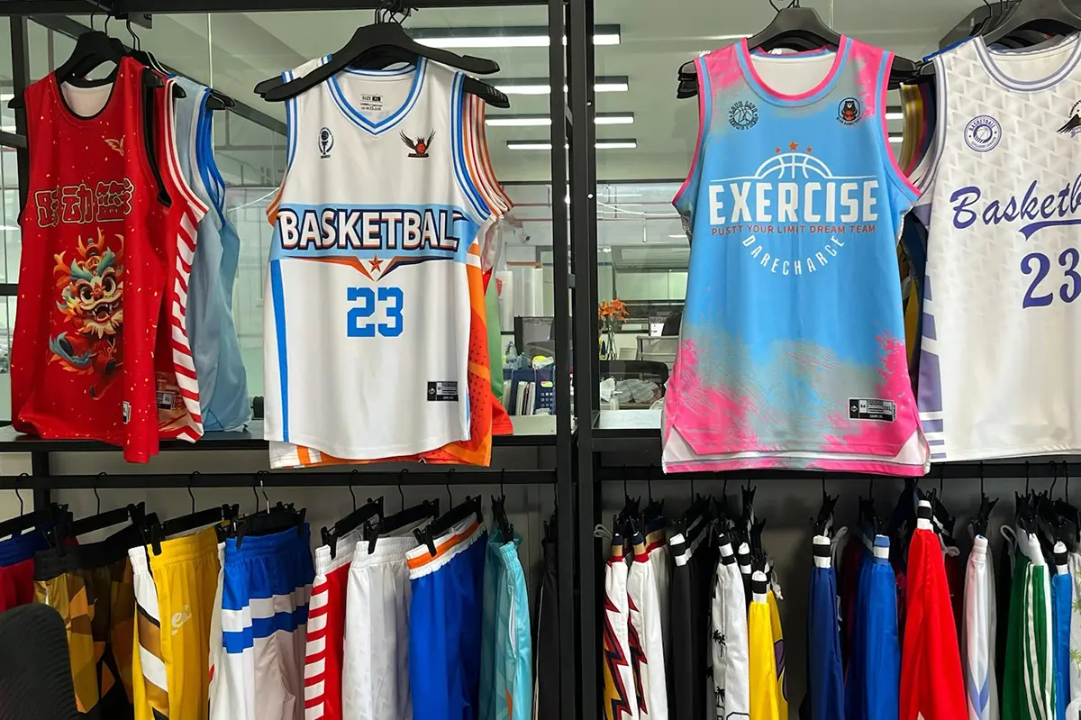 Basketball jersey samples showing different colors, necklines, logos, and player numbers
