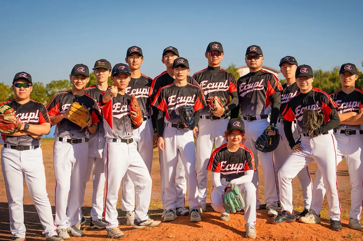 Baseball team wearing matching black and red button-front jerseys